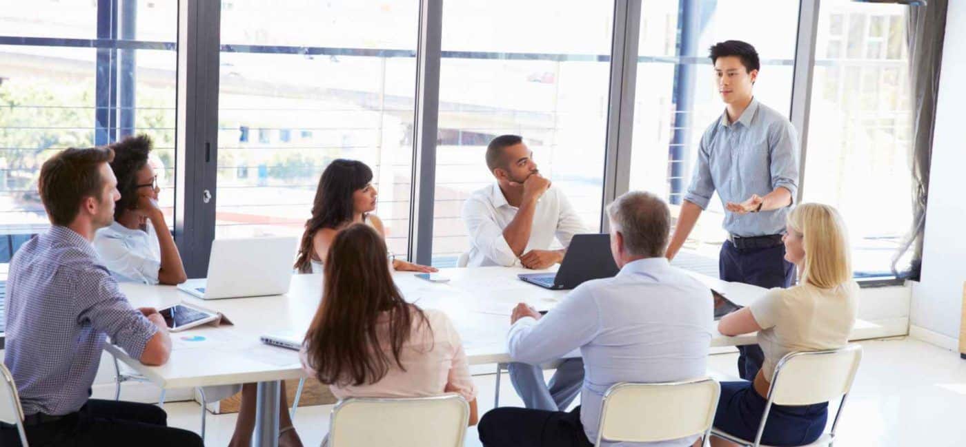 Team assembling in an office setting to emphasize collaboration importance