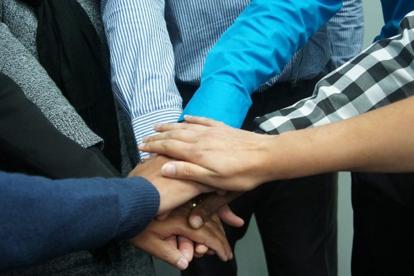 The image depicts collaboration and teamwork.