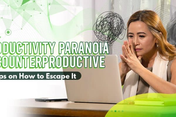 Woman in front of her laptop, appearing worried and paranoid.