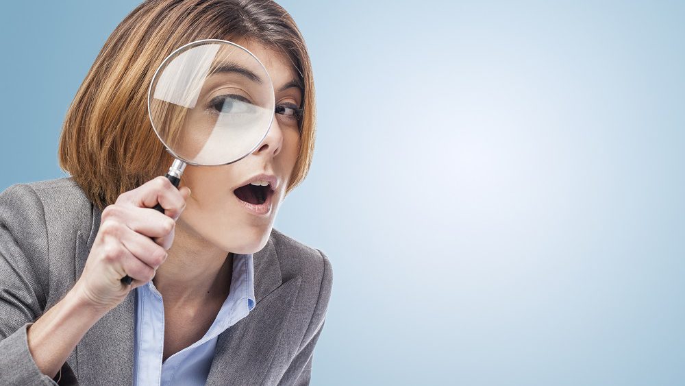 Woman with Magnifying Glass