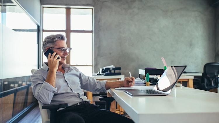 Businessman in office talking on phone