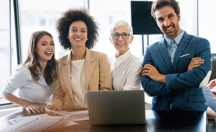 Three women and a man from different races and age groups