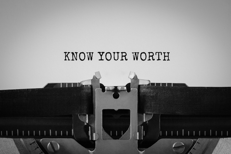 Typewriter with paper that shows the words Know Your Worth