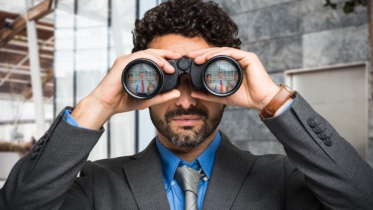 man holding binoculars