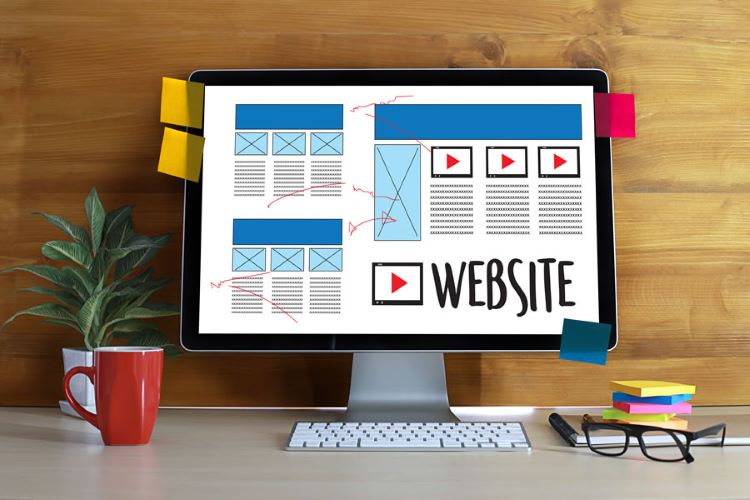 desktop monitor showing the word website and data in tabulated form