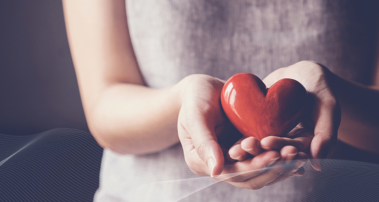 woman holding a heart