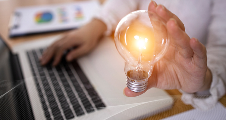 person holding a light bulb