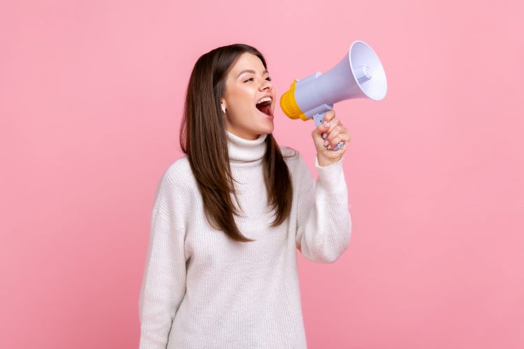 woman holding a megaphone