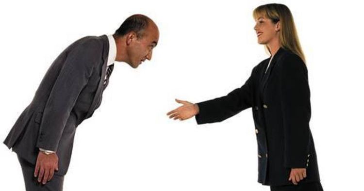 man bowing to a woman and woman holding her hand out to the man