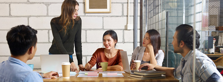 coworkers having a meeting over coffee