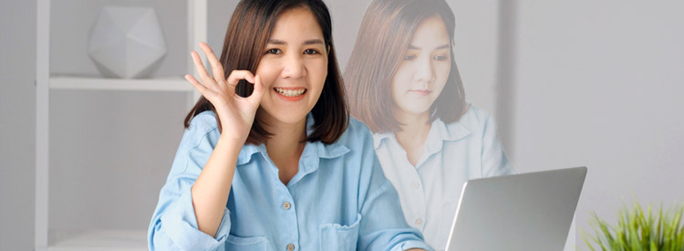 woman in blue shirt doing the ok sign